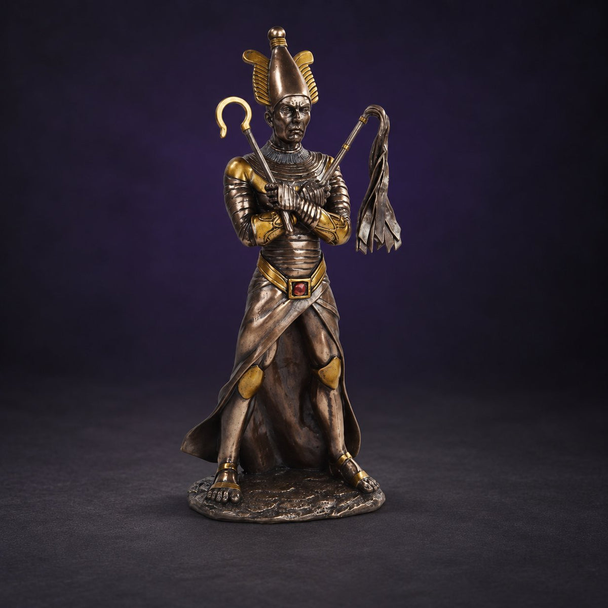 Egyptian Osiris Statue against a charcoal and royal purple background.