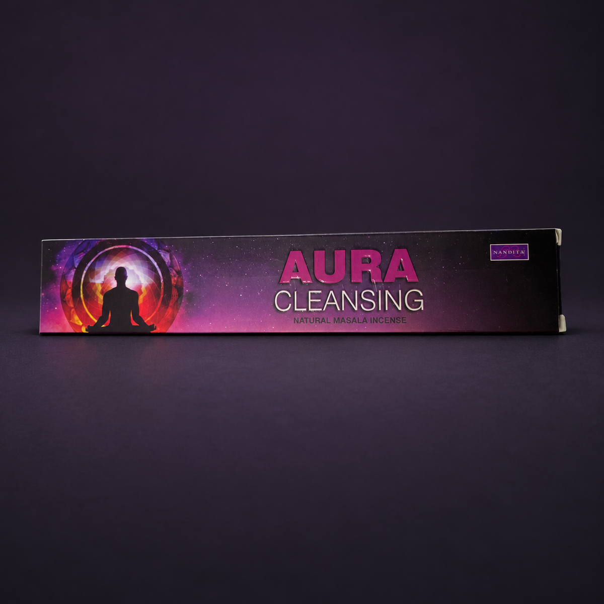 Aura Cleansing Natural Masala Incense package on a matte charcoal and subtle royal purple background.