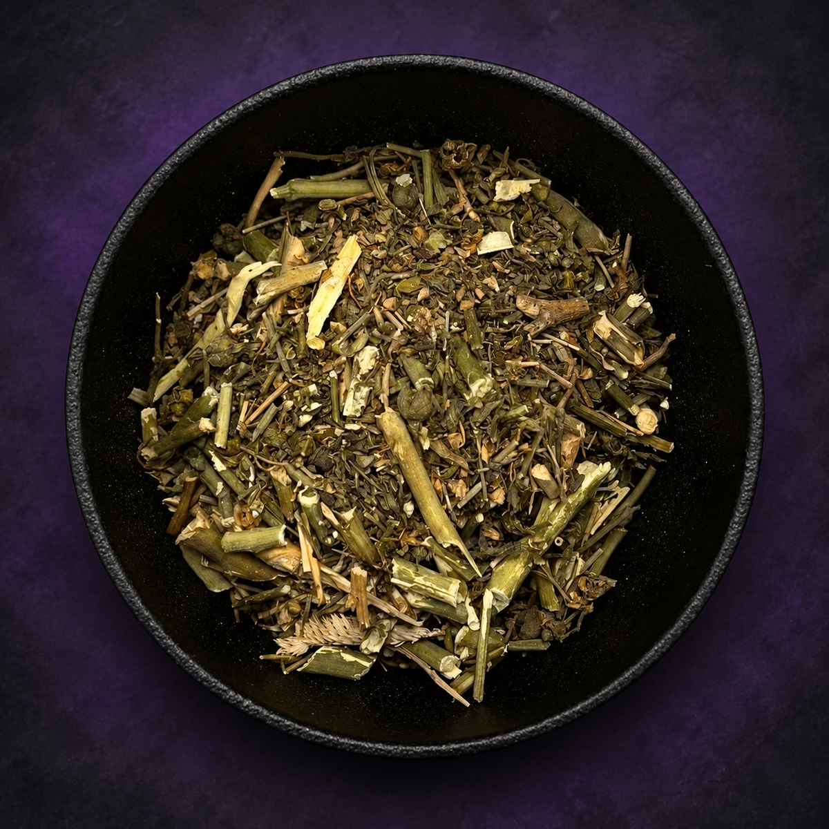 Dried rue in a black bowl on matte charcoal and deep royal-purple background.