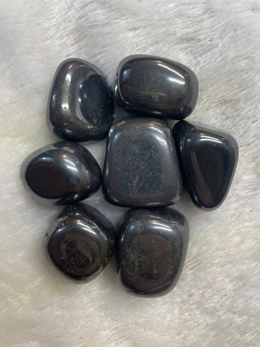 Representative polished gray hematite tumbled stones; each order includes one stone.